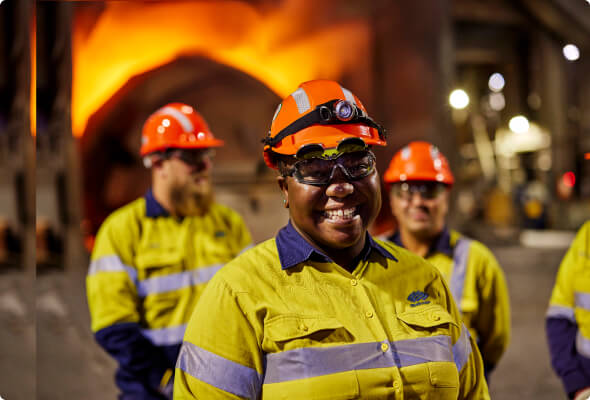 Group of BlueScope employees in a manufacturing facility 