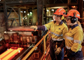 Two BlueScope site operators observing the production line